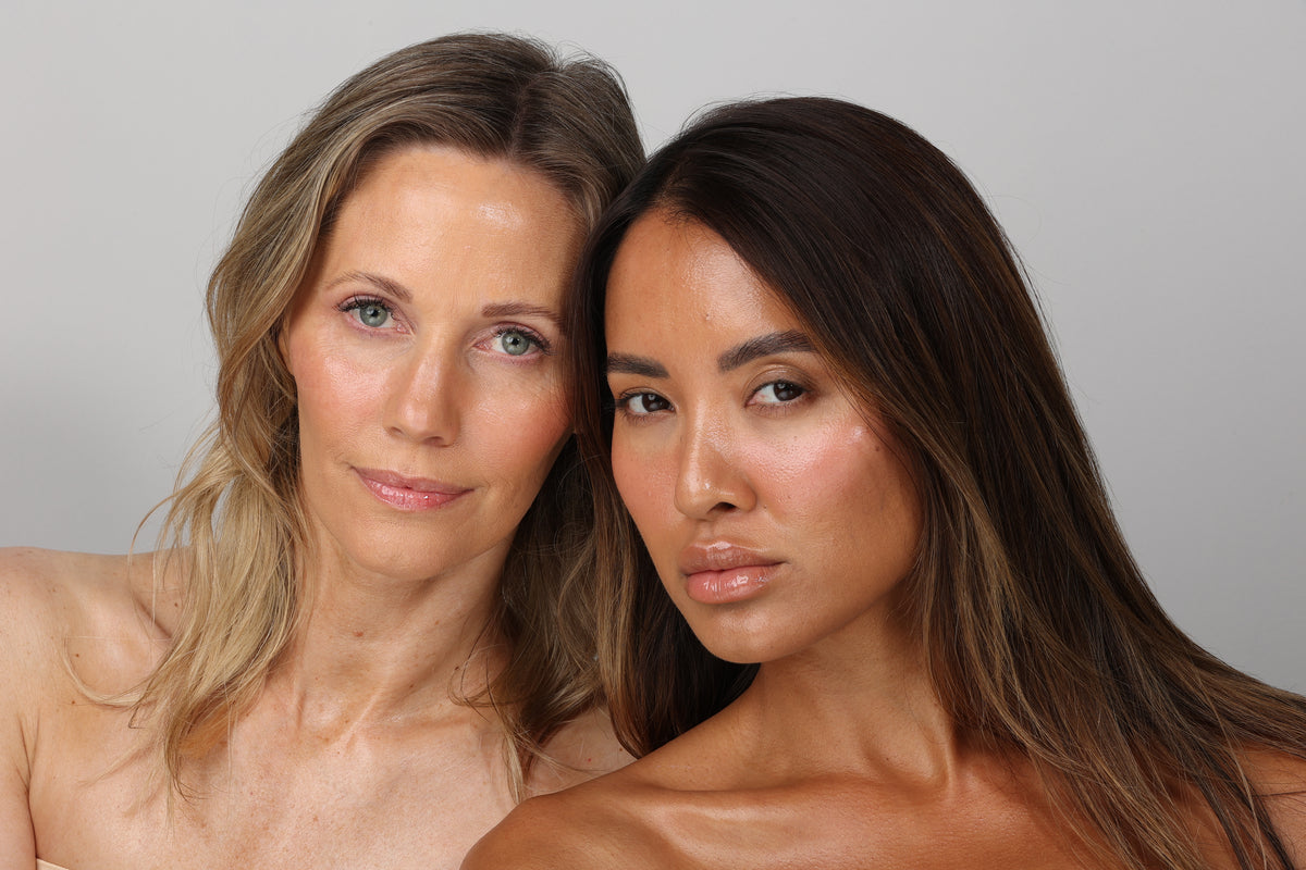 Two women with smooth, glassy skin showcasing radiant complexion